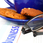 Reading The Business News In The Morning With A Cup Of Coffee