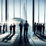 Silhouettes Of Multi-Ethnic Group Of Business People Working Tog